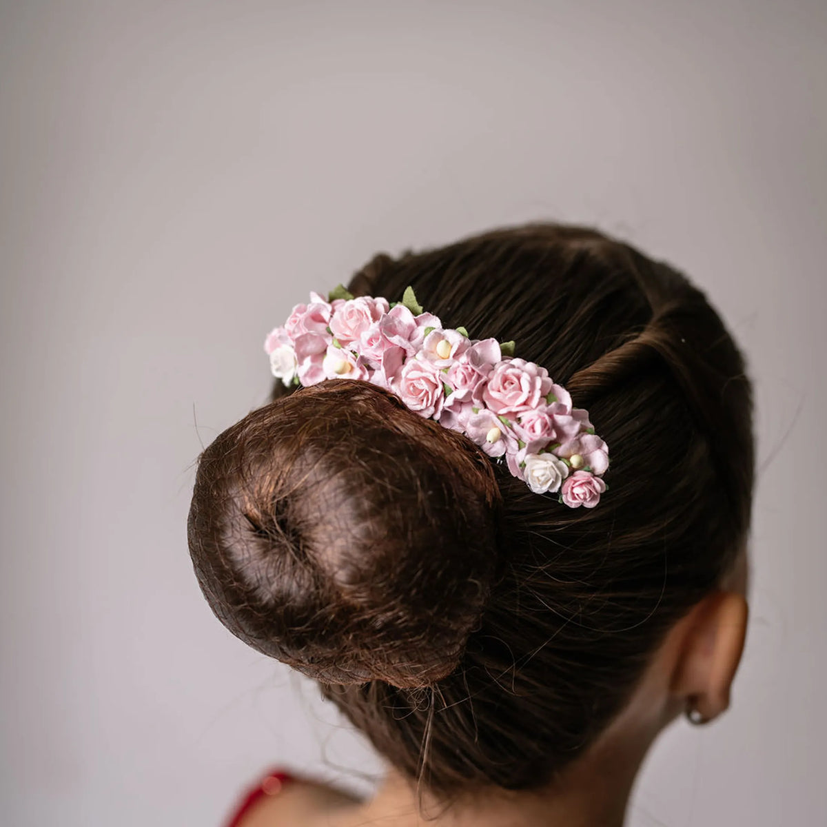 Ballet French twist clear hair comb with a pink and white floral design on a bun