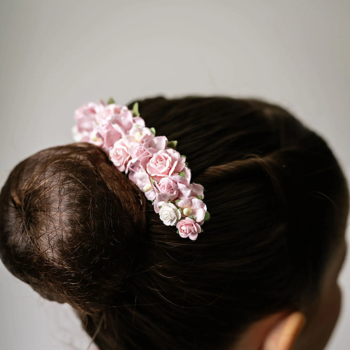 Ballet French twist clear hair comb with a pink and white floral design on a bun