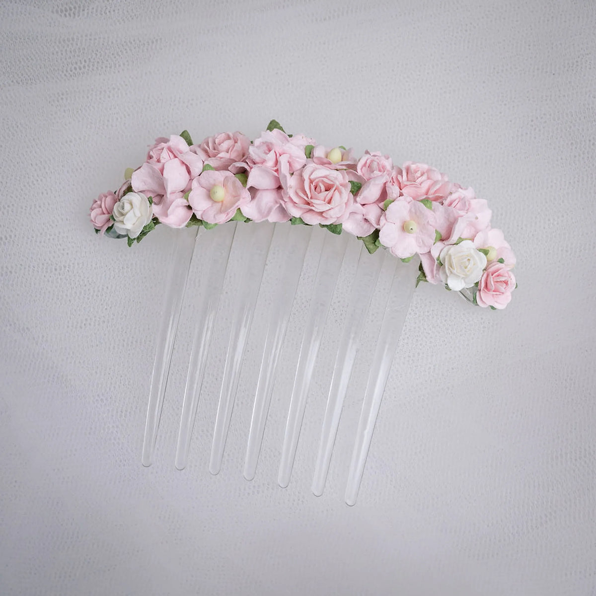 Ballet French twist clear hair comb with a pink and white floral design on a white background