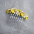 Ballet French twist clear hair comb with yellow and white floral design on a white background